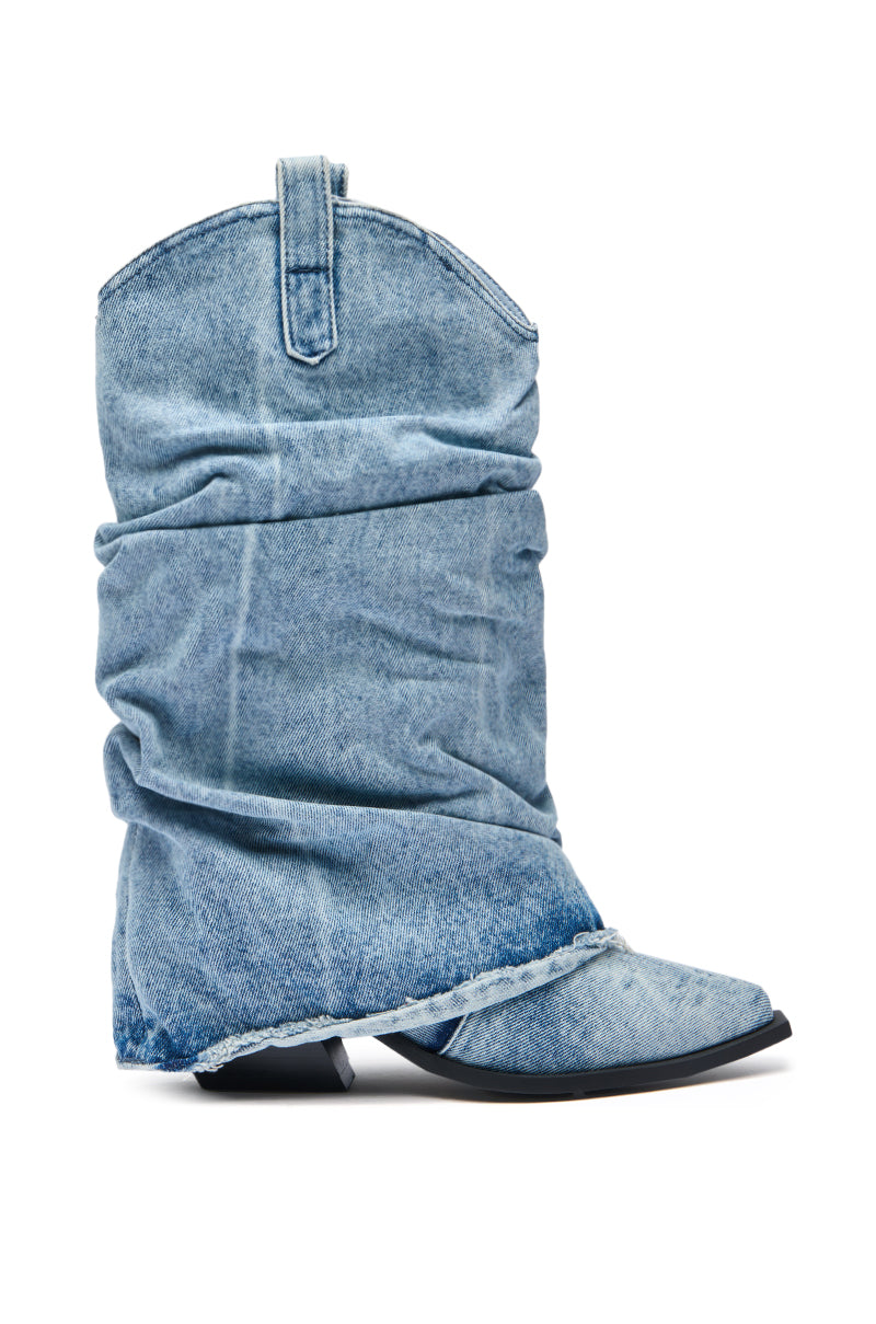 The AZALEA WANG HAWSTON DENIM WESTERN FOLD-OVER BOOT is a slouchy, knee-high light blue denim boot with visible seams, a pointed toe, low heel, and a convenient pull tab at the top. 4