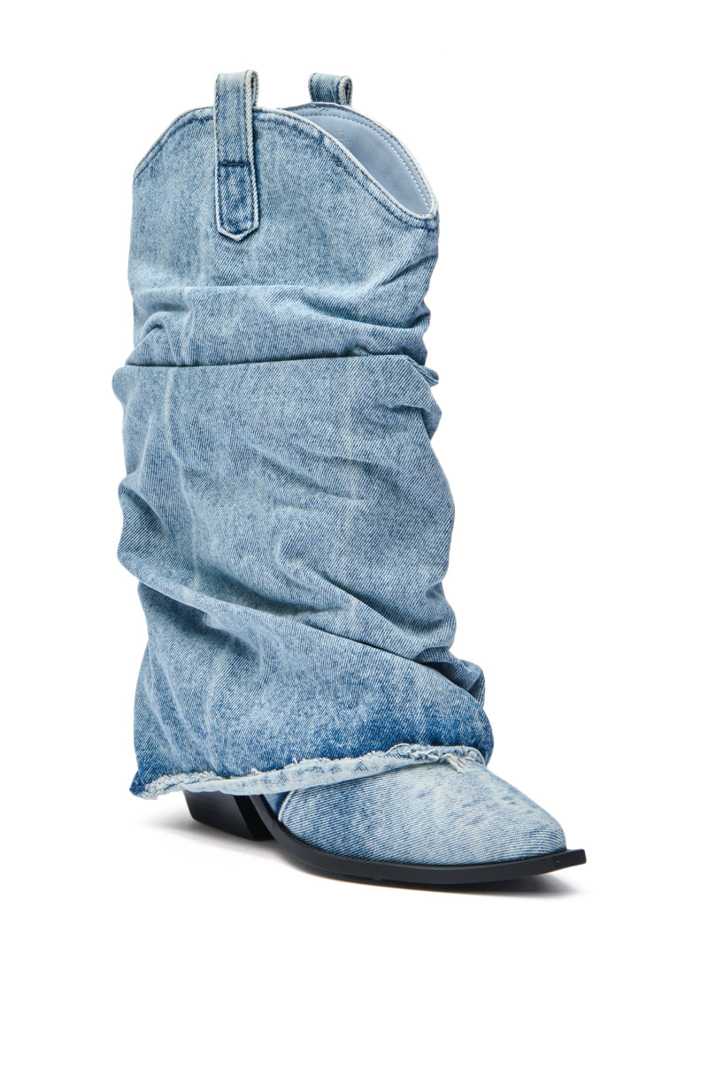 The AZALEA WANG HAWSTON DENIM WESTERN FOLD-OVER BOOT is a slouchy, light blue, faded denim boot with a pointed toe, low heel, visible seams, and frayed edges. 5