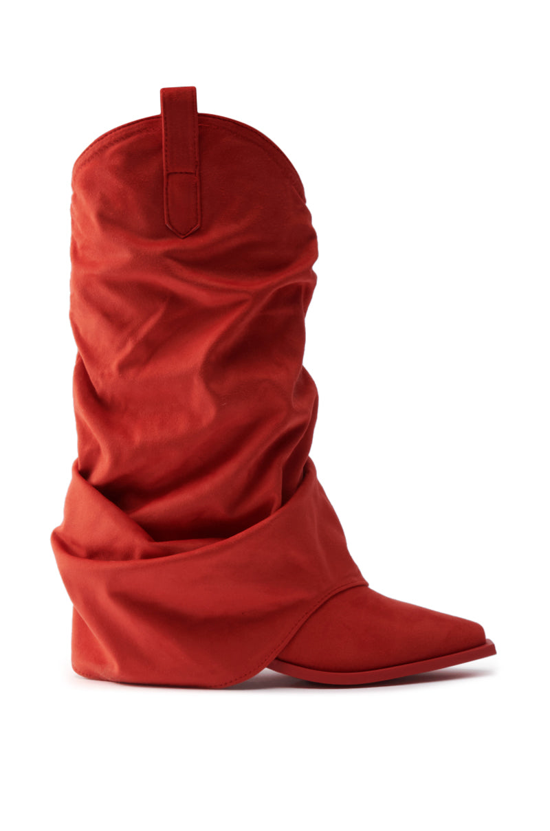 The AZALEA WANG HAWKSTON RED RUCHED WESTERN BOOTIE is a vibrant red, knee-high faux suede boot with a pointed toe, chunky heel, and soft folded fabric for a relaxed, ruched look, shown against a white background.