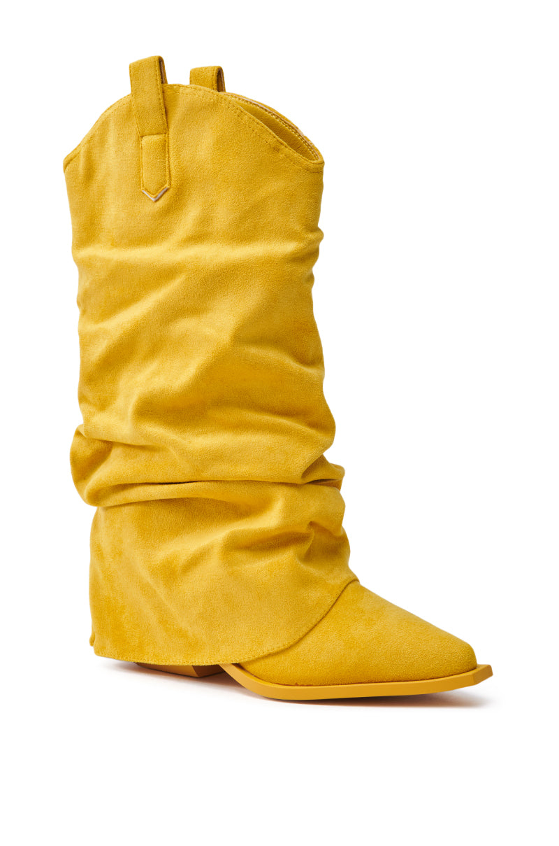 The AZALEA WANG HAWKSTON YELLOW BOOTIE is a yellow faux suede slouch cowboy bootie with a pointed toe and low chunky heel, featuring pull tabs at the top for easy wearing.