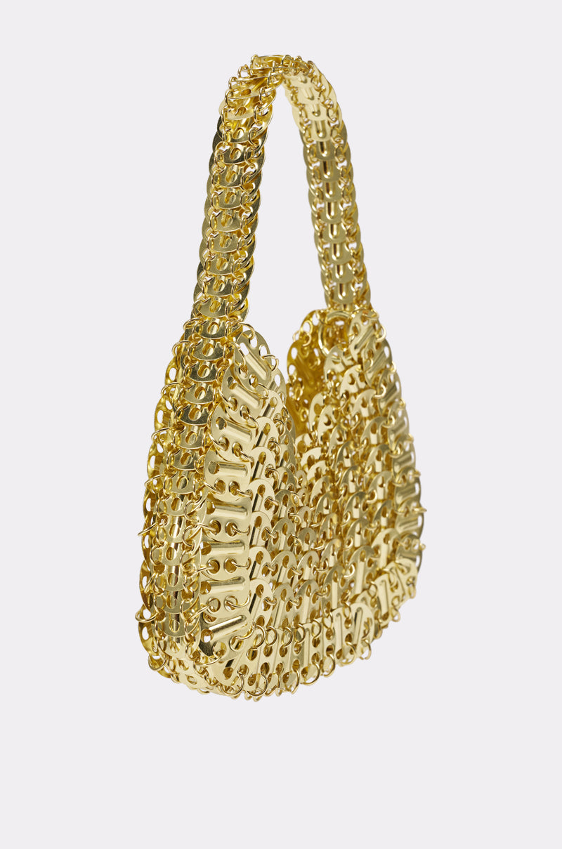 The TAYTAY METAL PURSE is a gold chainmail evening bag with a textured interlocking design and matching handle, displayed on a light gray background—an eye-catching statement accessory. 3