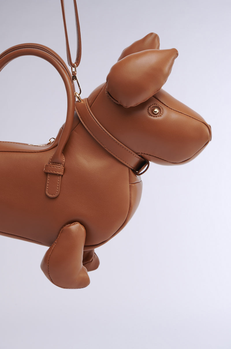 The I'M REALLY A DOG PURSE is a brown faux leather novelty bag with a rounded body, floppy ears, collar, and strap—charmingly displayed against a light background.