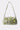 The IM OUT HERE BLING PURSE features a short strap, green and gold brocade design, and sparkling silver embellishments, shown on a plain white background.
