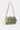 The IM OUT HERE BLING PURSE is a small, lime green brocade bag with gold floral embroidery, sparkling rhinestone accents, and a short strap, shown against a light background.