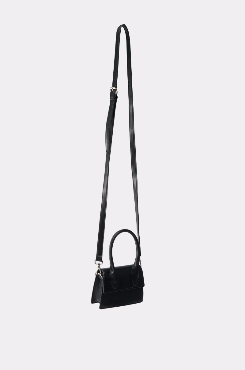 The JACKY BELT BAG is a small black handbag with a structured rectangular frame, two short handles, and a long adjustable shoulder strap, displayed against a plain light gray background. 8