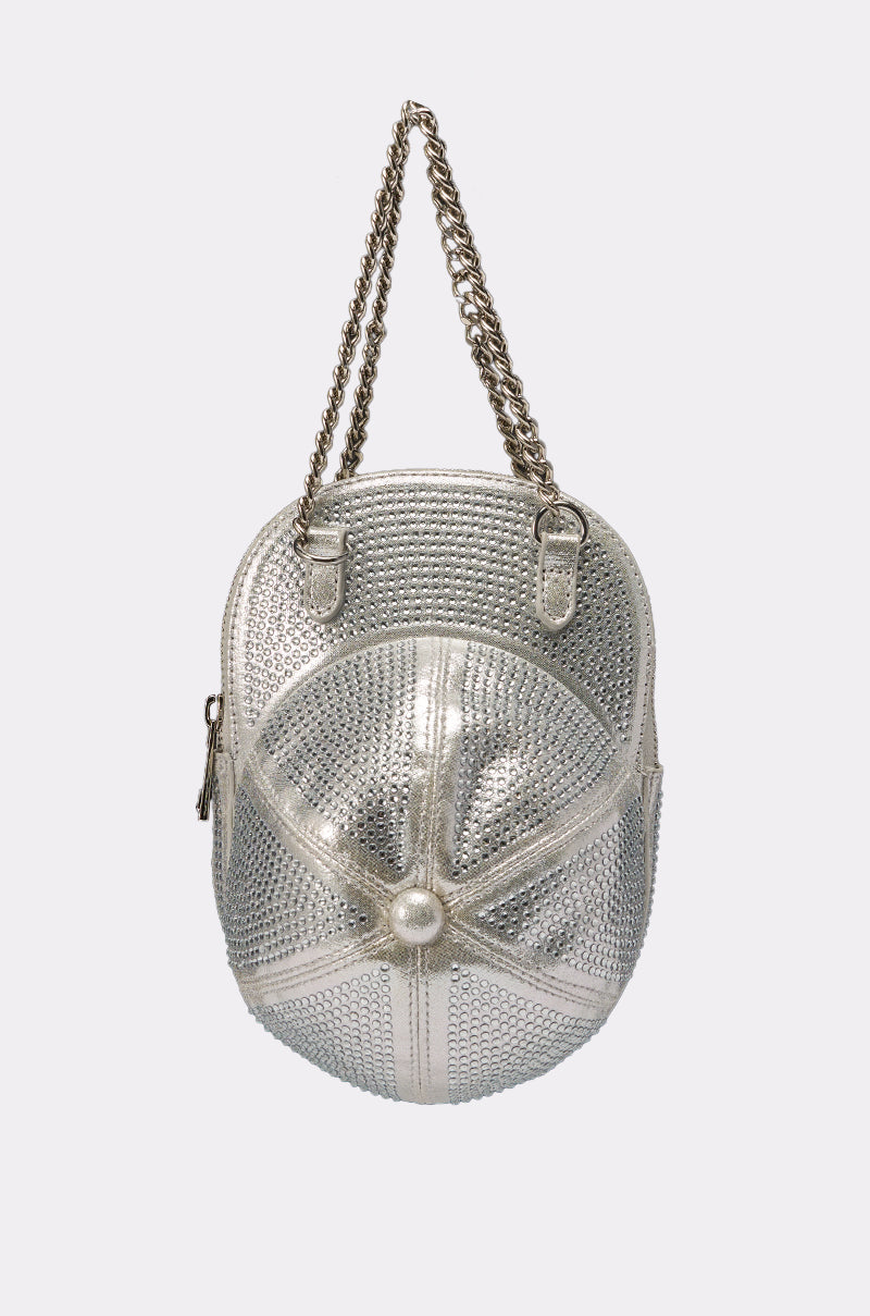 The NO CAP BLING PURSE is a metallic silver handbag shaped like a baseball, featuring seam details, a textured surface, metal chain strap, and side zipper for extra style. 0