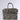 The TRY ME EMBELLISHED TOTE, a zebra print handbag with two handles and bold metallic spike accents along the edges and top, is displayed against a plain light background.