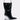 The STEP ON IT PURSE is a black, shiny bag shaped like a pointed-toe boot, featuring a silver metal handle and a transparent wedge-shaped heel, shown on a plain light background.