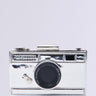 The TAKE MY PIC PURSE is a silver, vintage-style camera-shaped clutch set against a light gray background, featuring realistic details like a lens, buttons, and textured surfaces—ideal for fashion-forward enthusiasts looking for the perfect selfie accessory.
.
