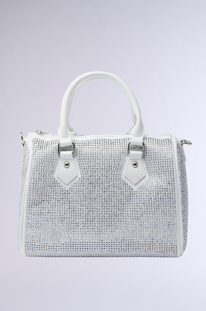 The BLING BOWLER BAG is a white handbag with two handles, a detachable shoulder strap, and a grid of shiny silver rhinestones, shown on a plain light gray background. 0