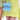 A person in a light yellow asymmetrical skirt holds the WORTH IT ALL FEATHER PURSE—a small blue feather bag with a checkered faux leather strap—while another in a green and silver patterned outfit stands nearby.
