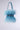 The WORTH IT ALL FEATHER PURSE is a fluffy blue bag with feathery material and a shiny rhinestone-accented strap, including a matching belt. It sits against a plain, light gray background.