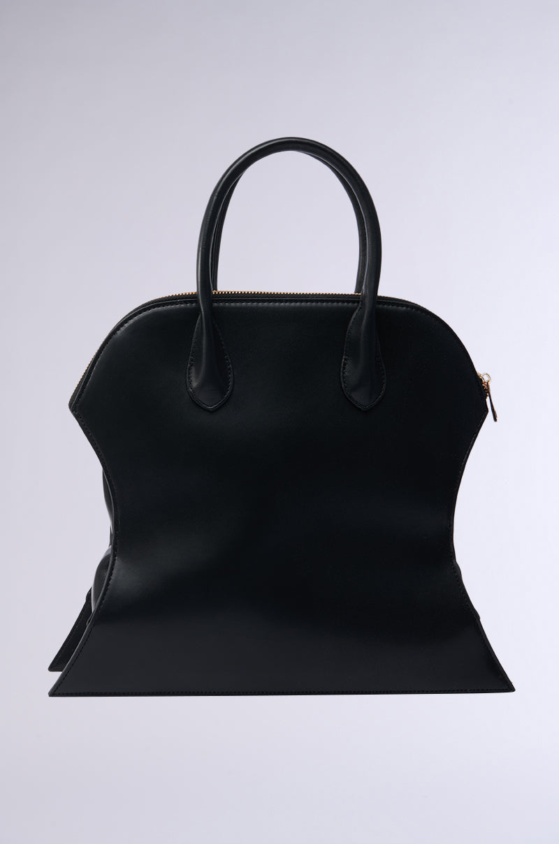 The YOU NOT USED TO THIS PURSE is a black faux leather handbag with a unique, distorted shape, curved sides and base, two handles, and a top zipper—an eye-catching accessory against a light grey background. 0