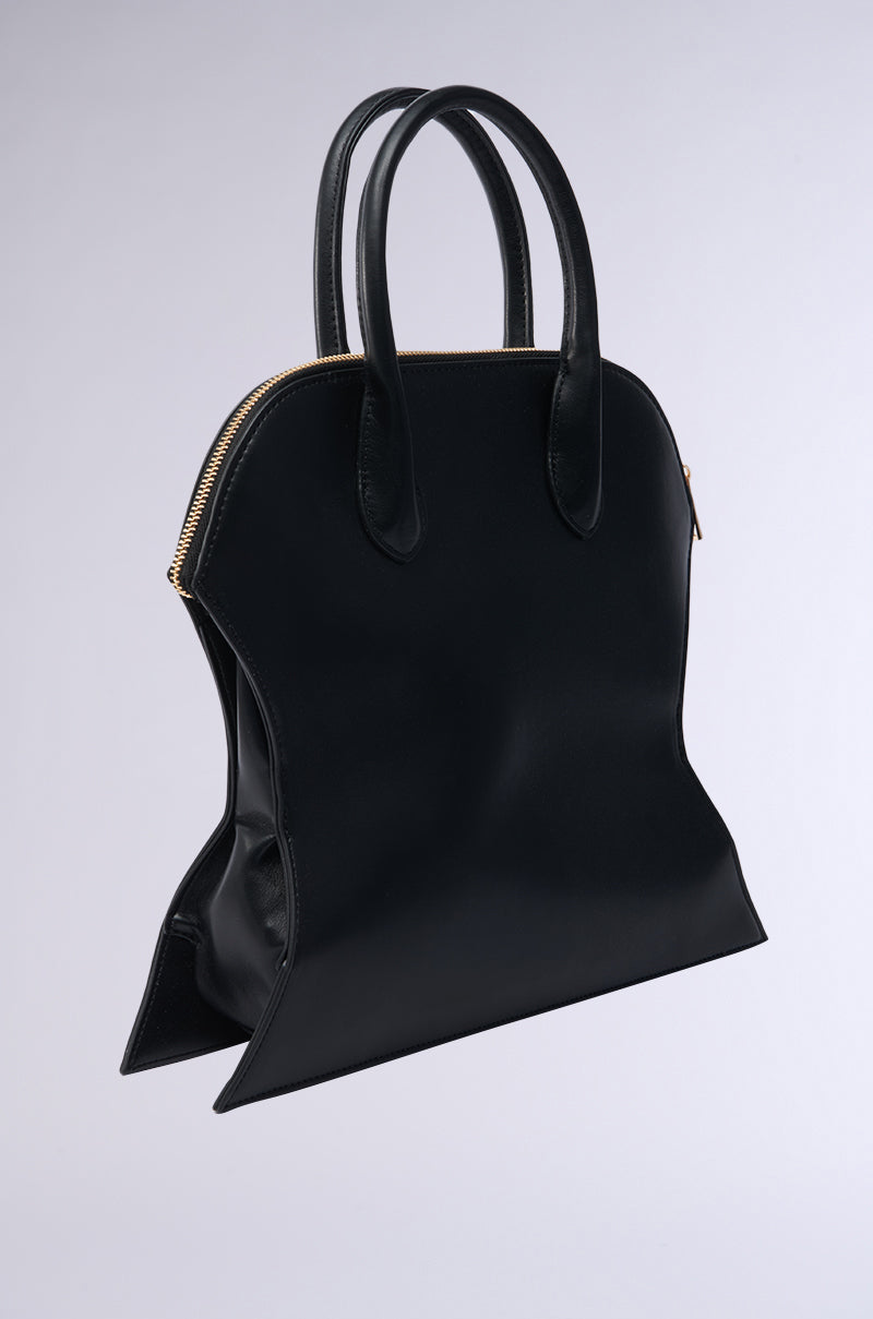 Make a bold statement with the YOU NOT USED TO THIS PURSE—a black faux leather handbag featuring a structured, pinched-in silhouette, gold zipper, and dual handles for a fashion-forward look. 2