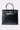 The FEEL ME OVERSIZED TOTE is a large black faux leather handbag with two handles, a structured rectangular shape, silver hardware, flap closure, and a suede-textured upper panel for added style.