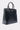 The FEEL ME OVERSIZED TOTE is a large, structured faux leather handbag with two handles, a flap closure, silver hardware, and lock-and-key detail, shown against a plain light background.