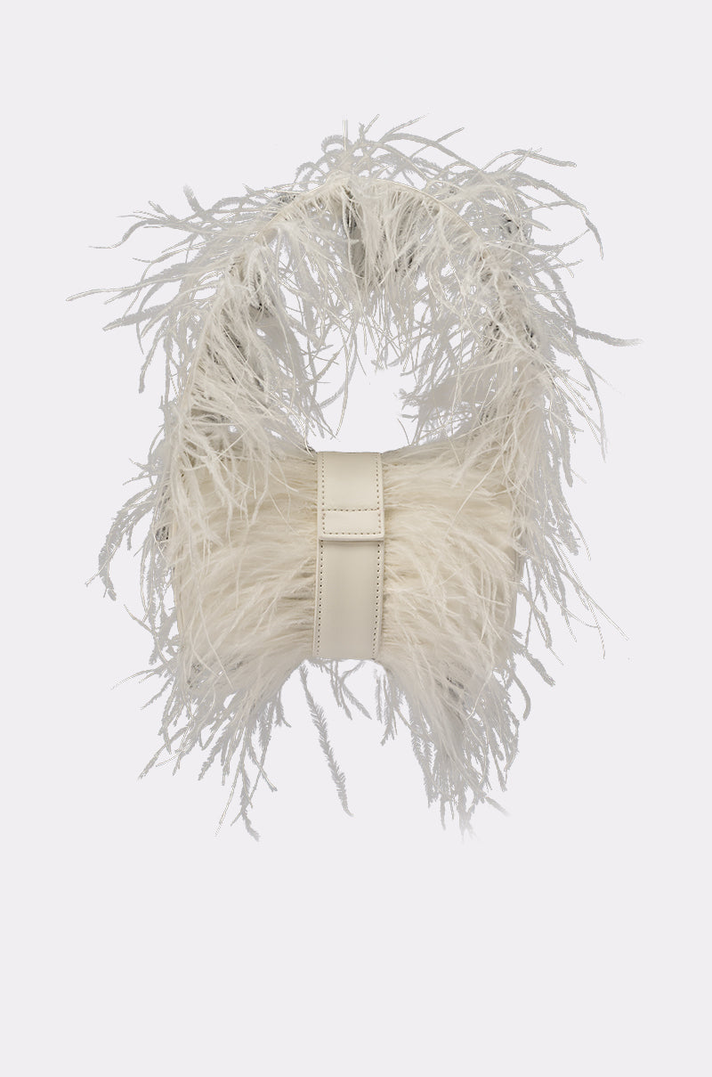 The LET ME FLY PURSE is a chic white faux leather handbag adorned with long, wispy feather-like embellishments for a fluffy, textured look—ideal as a unique bridal bag or standout statement accessory. 1