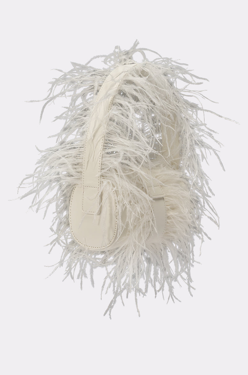 The LET ME FLY PURSE, designed with soft, white feathery material for a fluffy, decorative look like a chic feather handbag, is displayed against a plain light background. 2