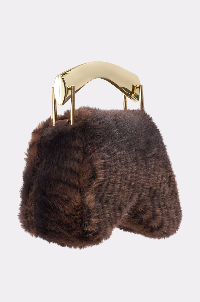 The COCO FAUX FUR BAG is a small, rectangular clutch with a structured design, featuring soft faux fur and a shiny metallic gold handle. Shown against a plain white background. 2