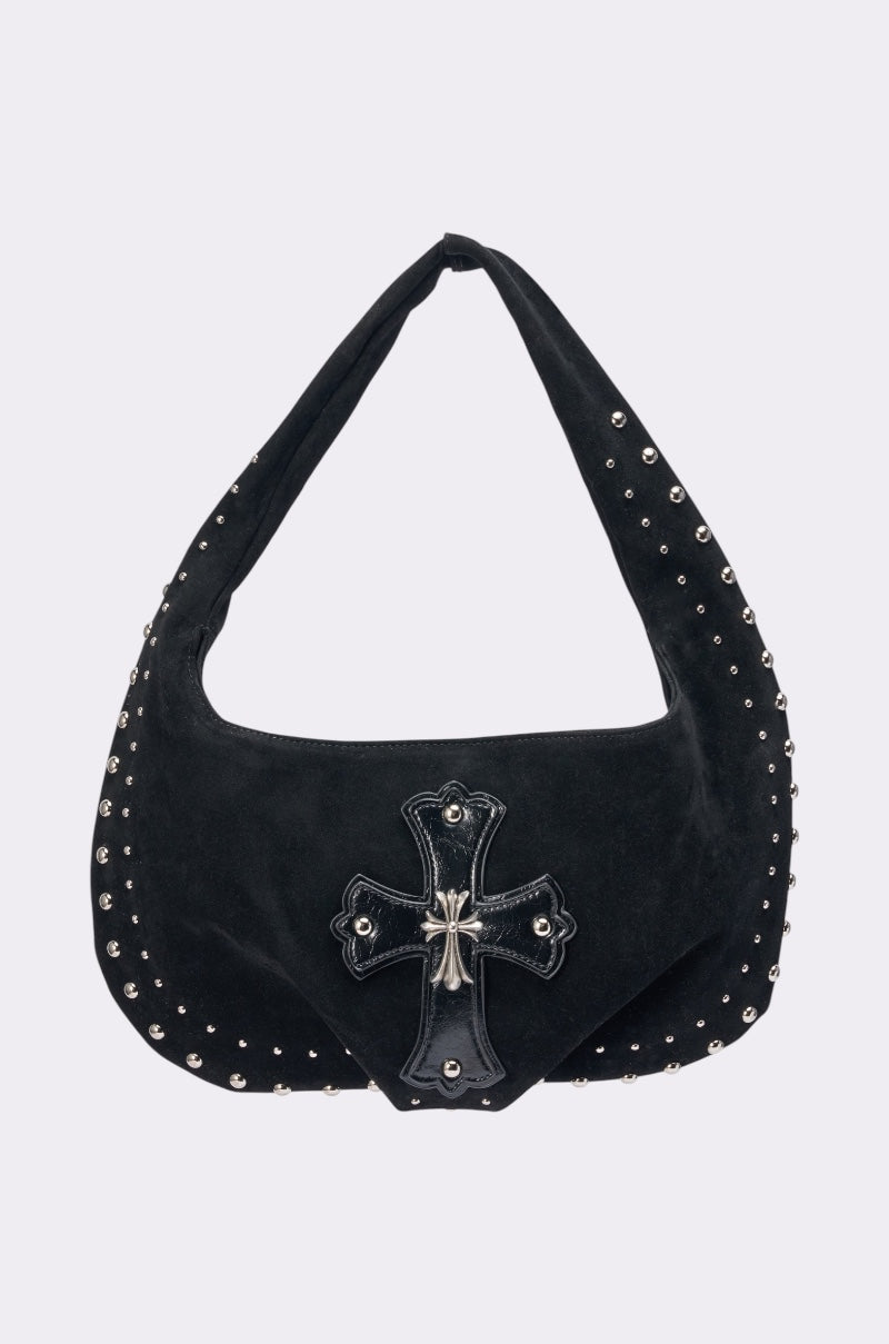 The REALLY THAT GIRL SUEDE BAG is a black faux suede festival bag featuring silver stud accents along the edges and a bold studded cross with a silver center detail—perfect for making a statement. 1