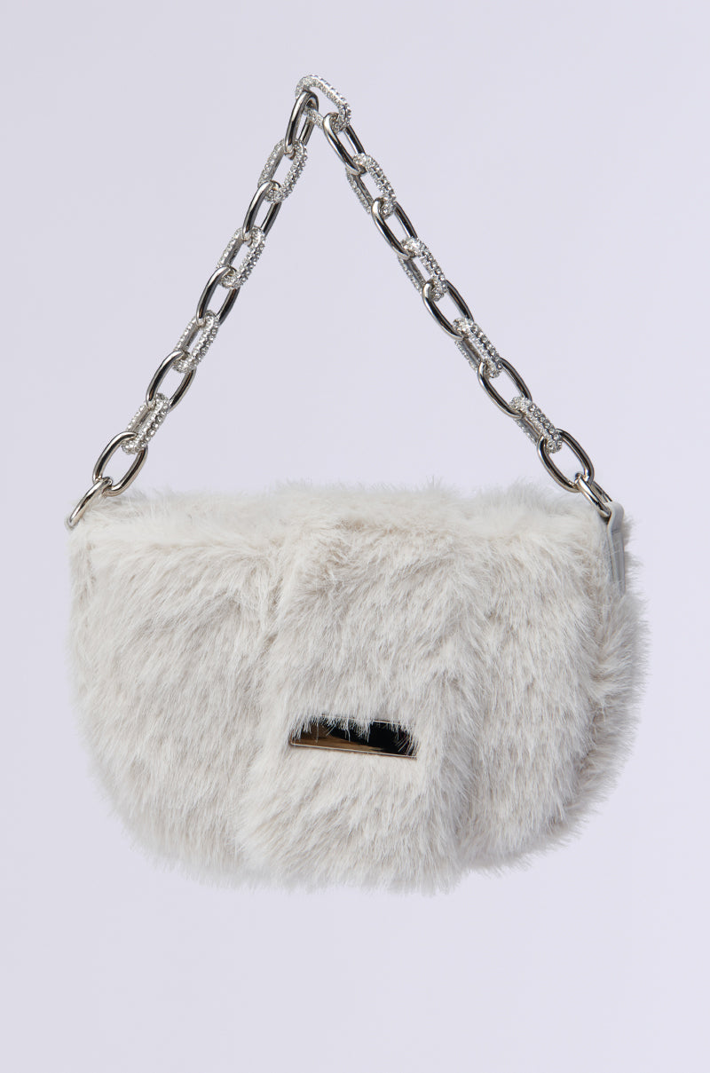 Introducing the JACQUES FAUX FUR MINI PURSE: a fluffy white faux fur handbag with a silver chain strap and a small metallic accent on the front. 0