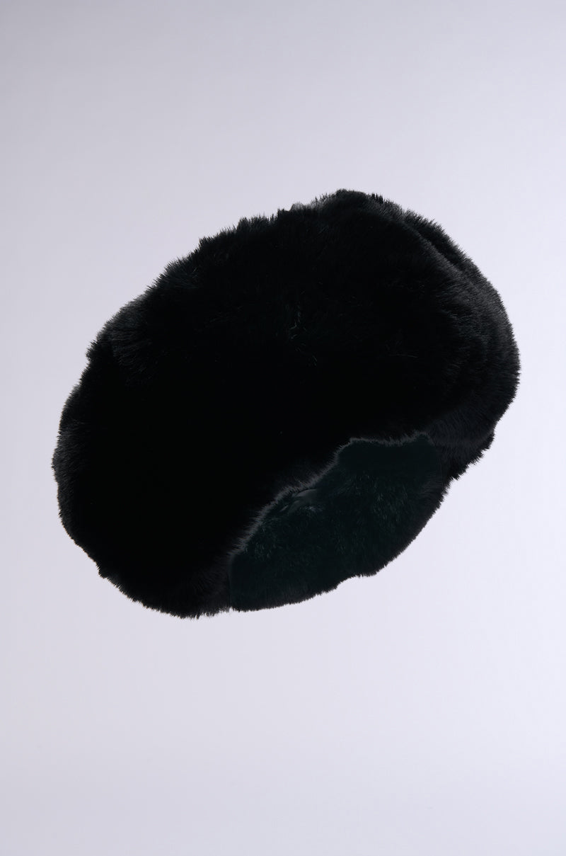The LUXE JENNY Faux Fur Headband in black is displayed against a plain light gray background, featuring plush, round faux fur for a cozy and stylish winter accessory.