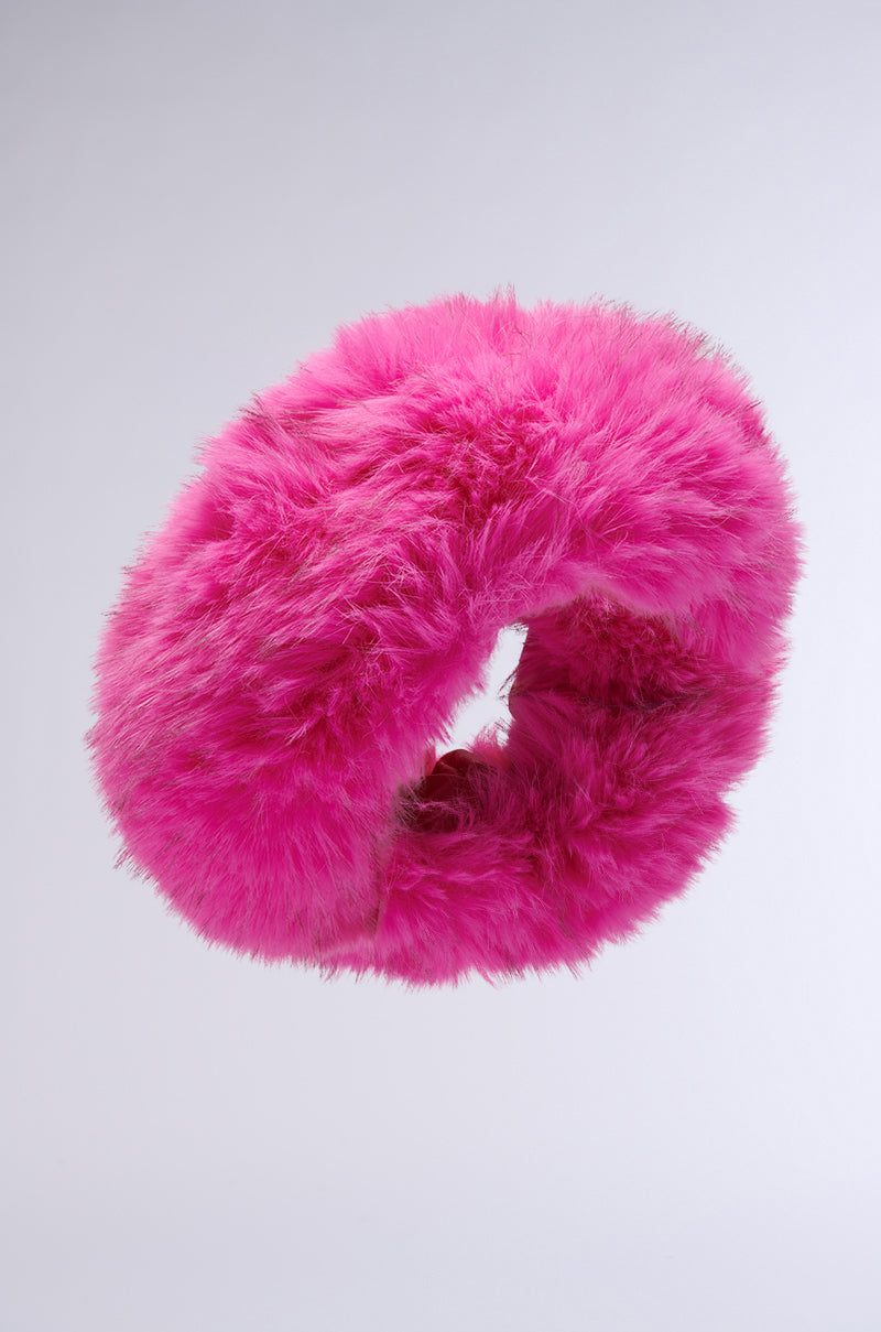 A vibrant pink SABRINA FAUX FUR HEADBAND made from plush faux fur, featuring a soft, fuzzy texture against a plain light gray background.