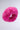 A vibrant pink SABRINA FAUX FUR HEADBAND made from plush faux fur, featuring a soft, fuzzy texture against a plain light gray background.