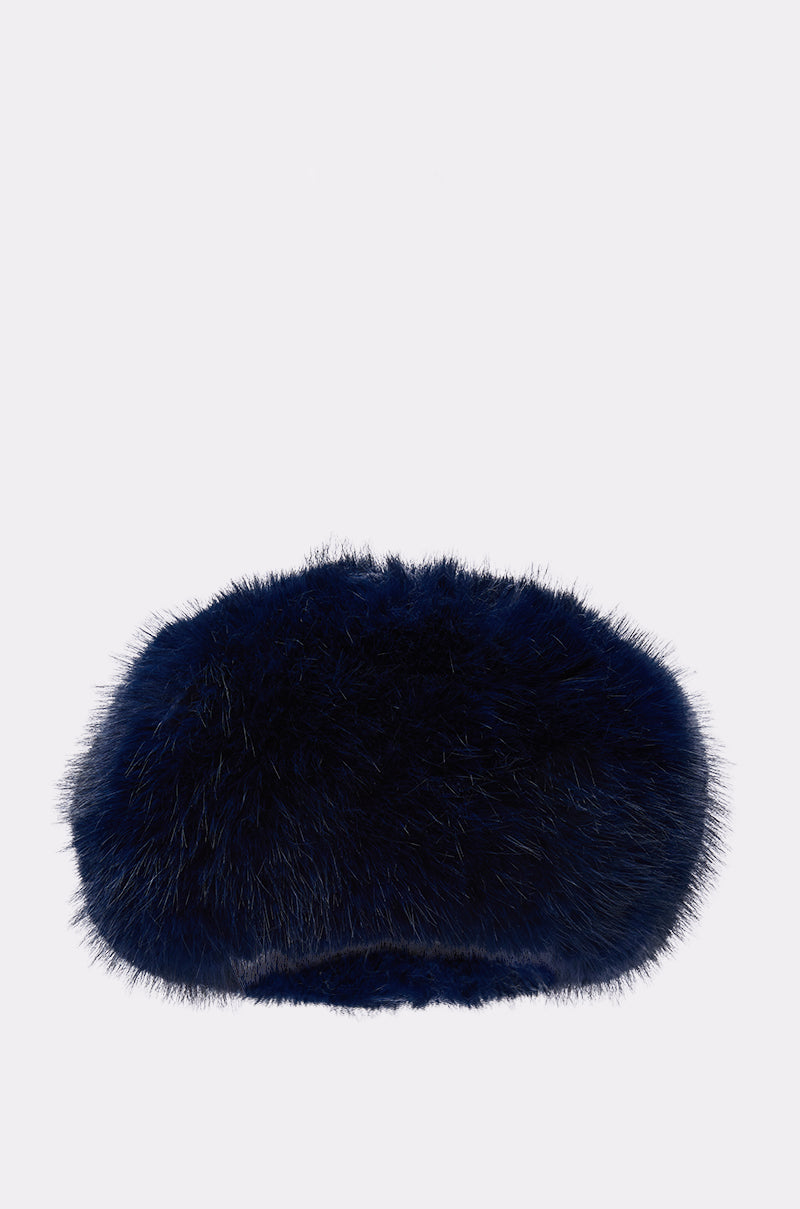 The SO CHIC FAUX FUR HEADBAND, a dark blue, fluffy accessory from the AKIRA Label, is shown against a plain white background.