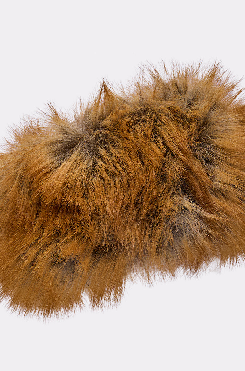 A close-up of the REALLY LIKE THAT FAUX FUR HEADBAND in fluffy brown and black faux fox fur, set against a plain light gray background—an ideal chic accessory for cold weather. 7
