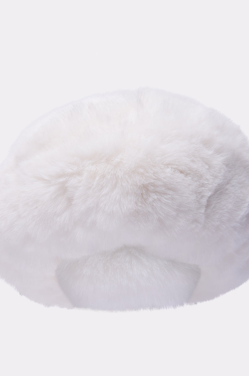 The LUXE JENNY FAUX FUR HEADBAND IN WHITE is displayed against a plain light background, showcasing its fluffy, soft texture—ideal for keeping ears warm or adding a cozy, stylish touch to your winter look.