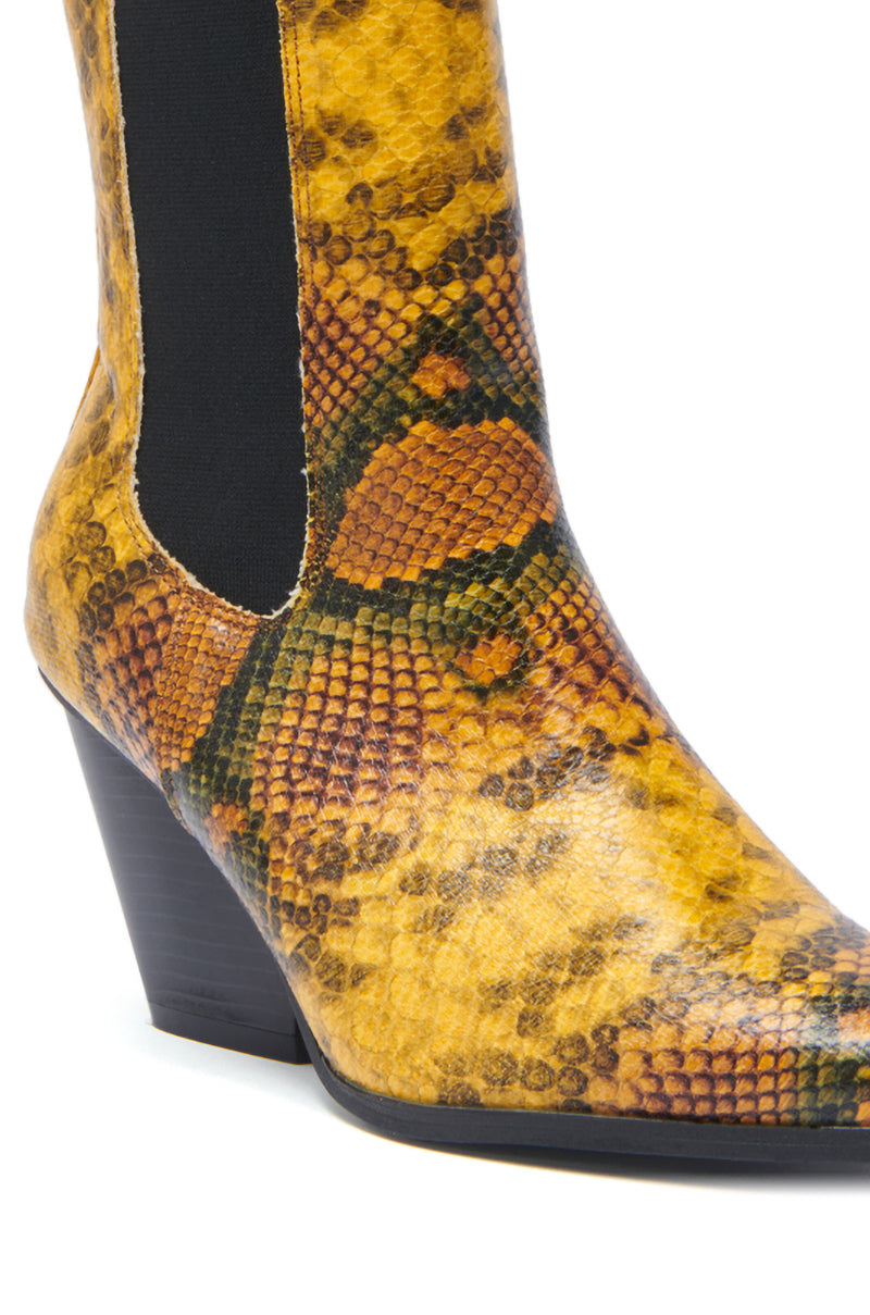 Close-up of the AZALEA WANG HENDERSON YELLOW CHUNKY BOOTIE featuring yellow and brown faux leather snakeskin pattern, black elastic side panel, and a mid-height block heel.