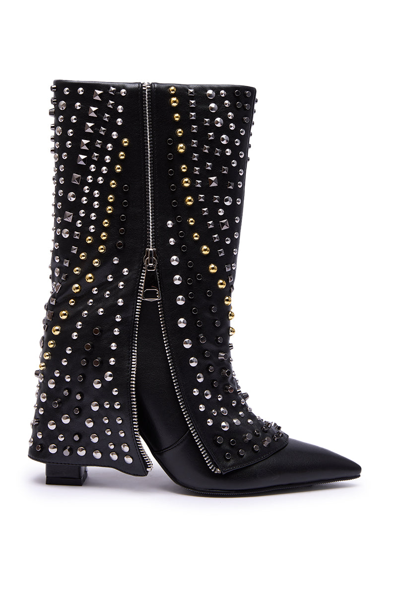 The AZALEA WANG HENZI BLACK HARDWARE EMBELLISHED CHUNKY FOLD OVER BOOTIE features black faux leather, a pointed toe, low block heel, dual side zippers, and curved silver and gold stud embellishments for a stylish look.