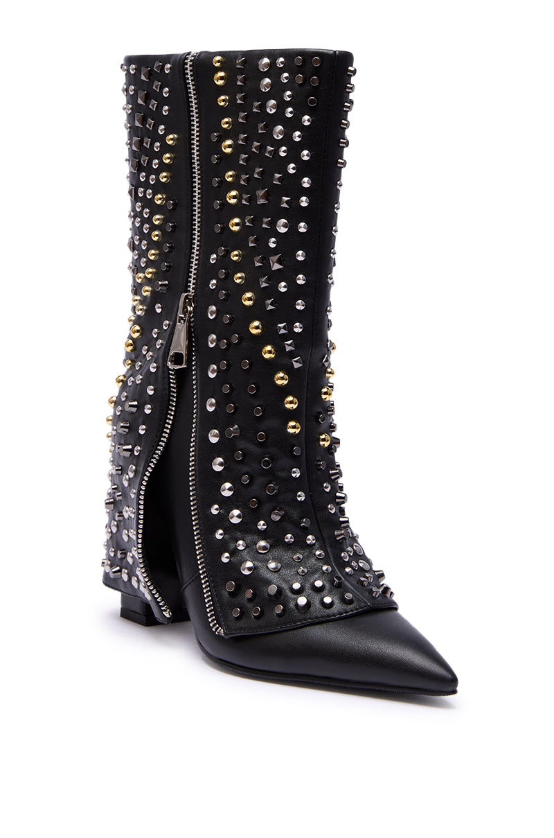 The AZALEA WANG HENZI BLACK HARDWARE EMBELLISHED CHUNKY FOLD OVER BOOTIE is a black faux leather pointed-toe ankle boot with silver and gold studs and a striking front silver zipper.