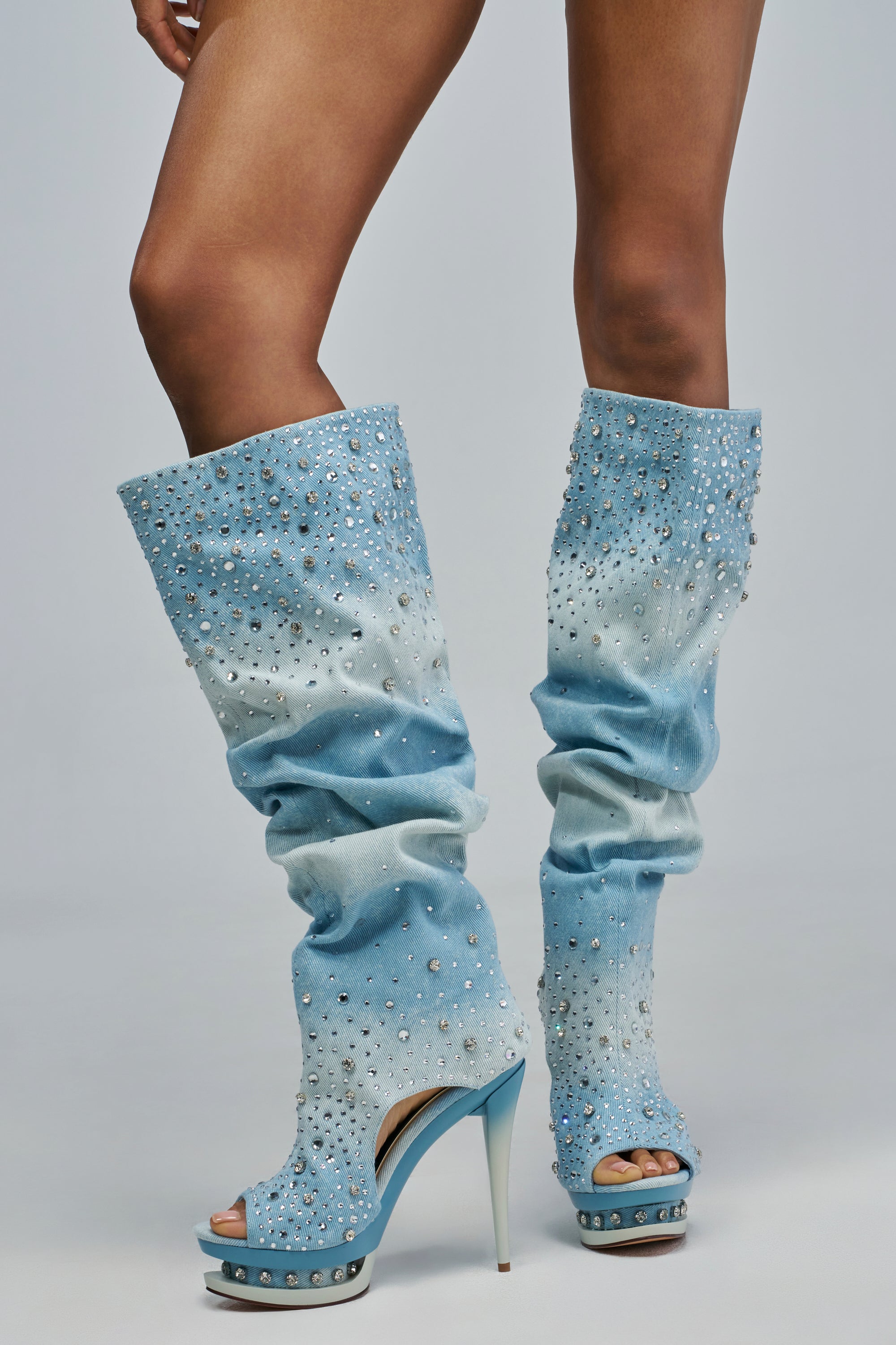 AZALEA WANG HERMINE DENIM RHINESTONE STILETTO BOOT in light-wash denim, featuring a knee-high design, rhinestone embellishments, a peep-toe, and a platform sole.