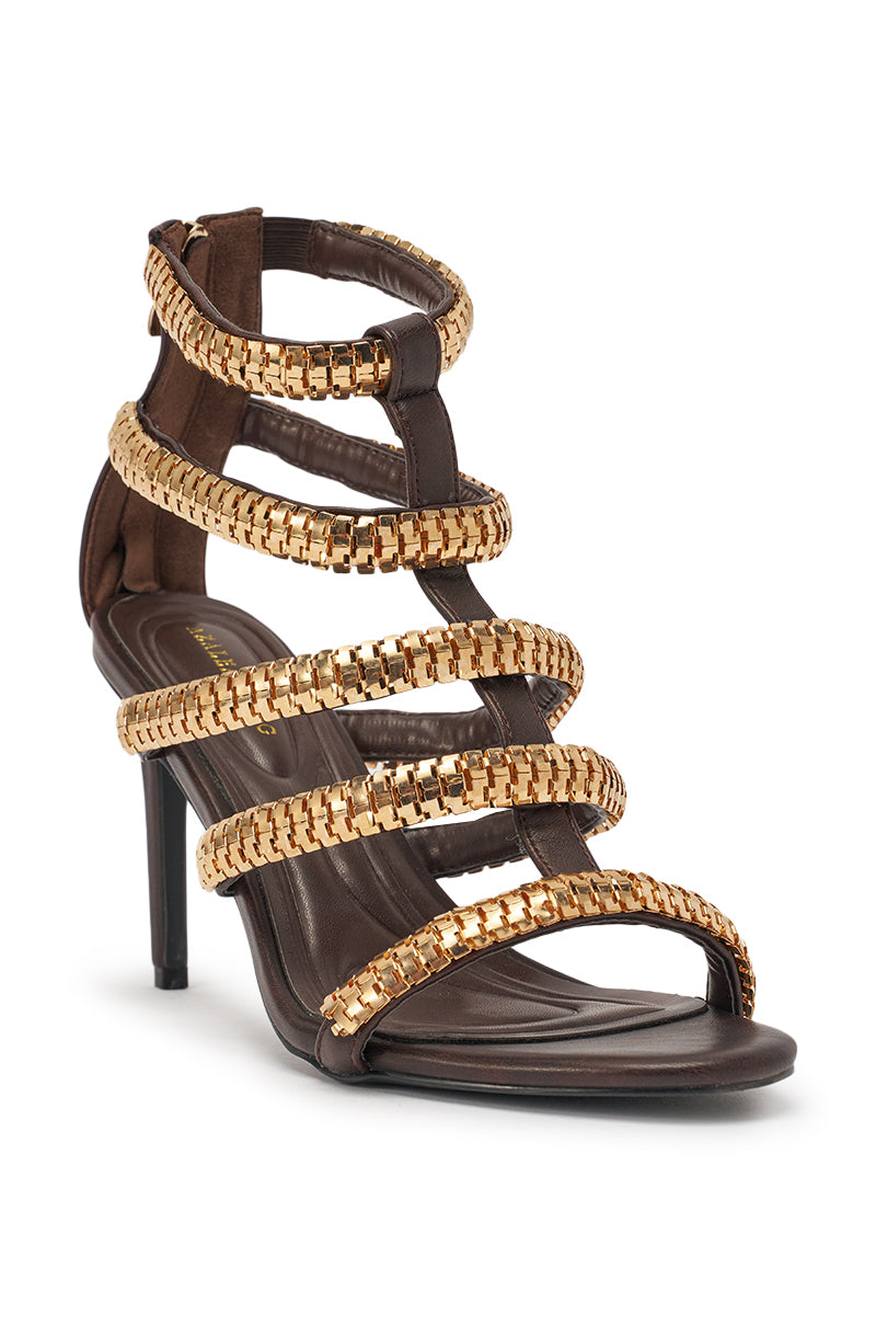 The AZALEA WANG HERSILIE BROWN GLADIATOR STILETO features multiple metallic gold straps, a dark brown base, ankle-high stiletto heels, a back zipper, and an open toe design. 6