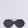 Introducing the MEME SUNGLASSES by the AKIRA Label, these black oversized sunglasses feature a sleek, futuristic design. With tinted lenses and a thin silver metal frame, these aviator-style shades showcase a curved, visor-like shape set against a plain white background.