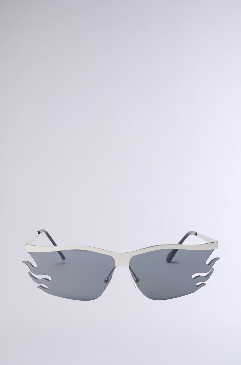 The "FEEL THE FLAME SUNGLASSES" feature sleek metallic frames, tinted lenses, and adjustable nose pads, set against a plain background.