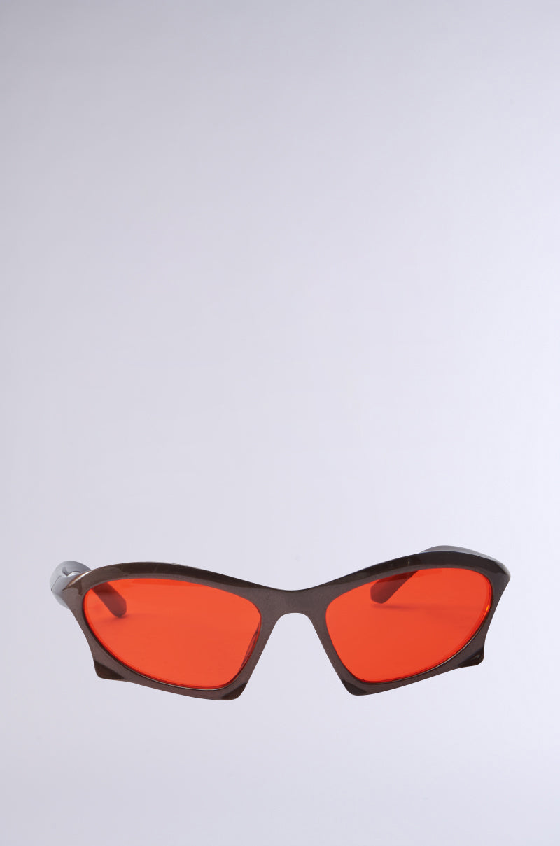 SEEING RED SUNGLASSES with a sleek design featuring vibrant red-tinted lenses and black frames, set against a plain light gray background. 0