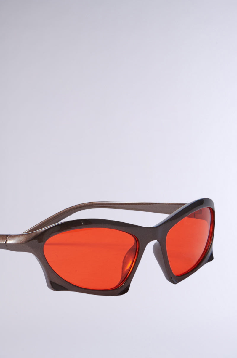 SEEING RED SUNGLASSES featuring a sleek metallic frame and vibrant red-tinted lenses, showcased against a plain gray background. 4
