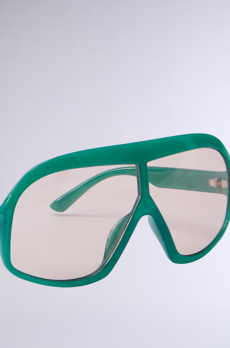 A pair of ALYSSA Sunglasses featuring oversized green aviator-style frames and lightly tinted lenses, shown from the front against a light gray background. 5