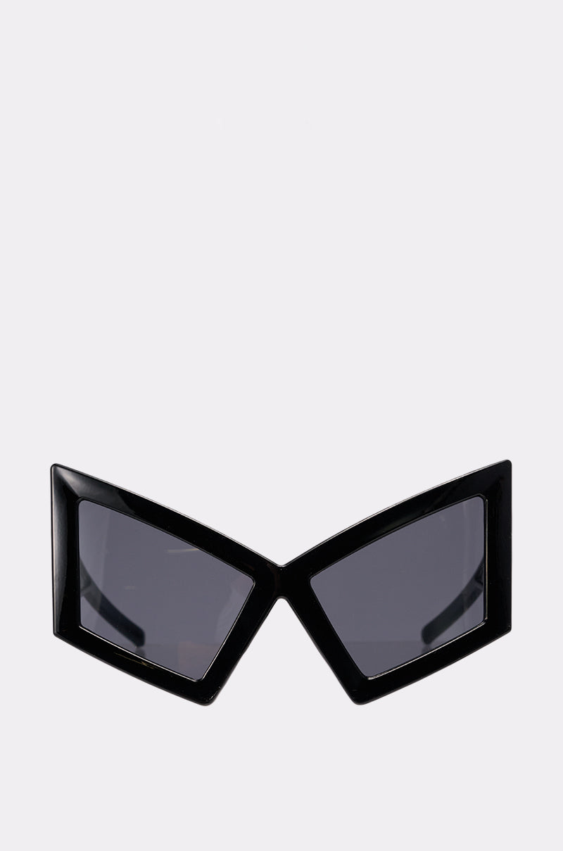 U HAVE TO GET IT SUNGLASSES feature black, geometric cat-eye frames with sharp, rhombus-shaped lenses and a Matrix-inspired look, shown against a plain light background.