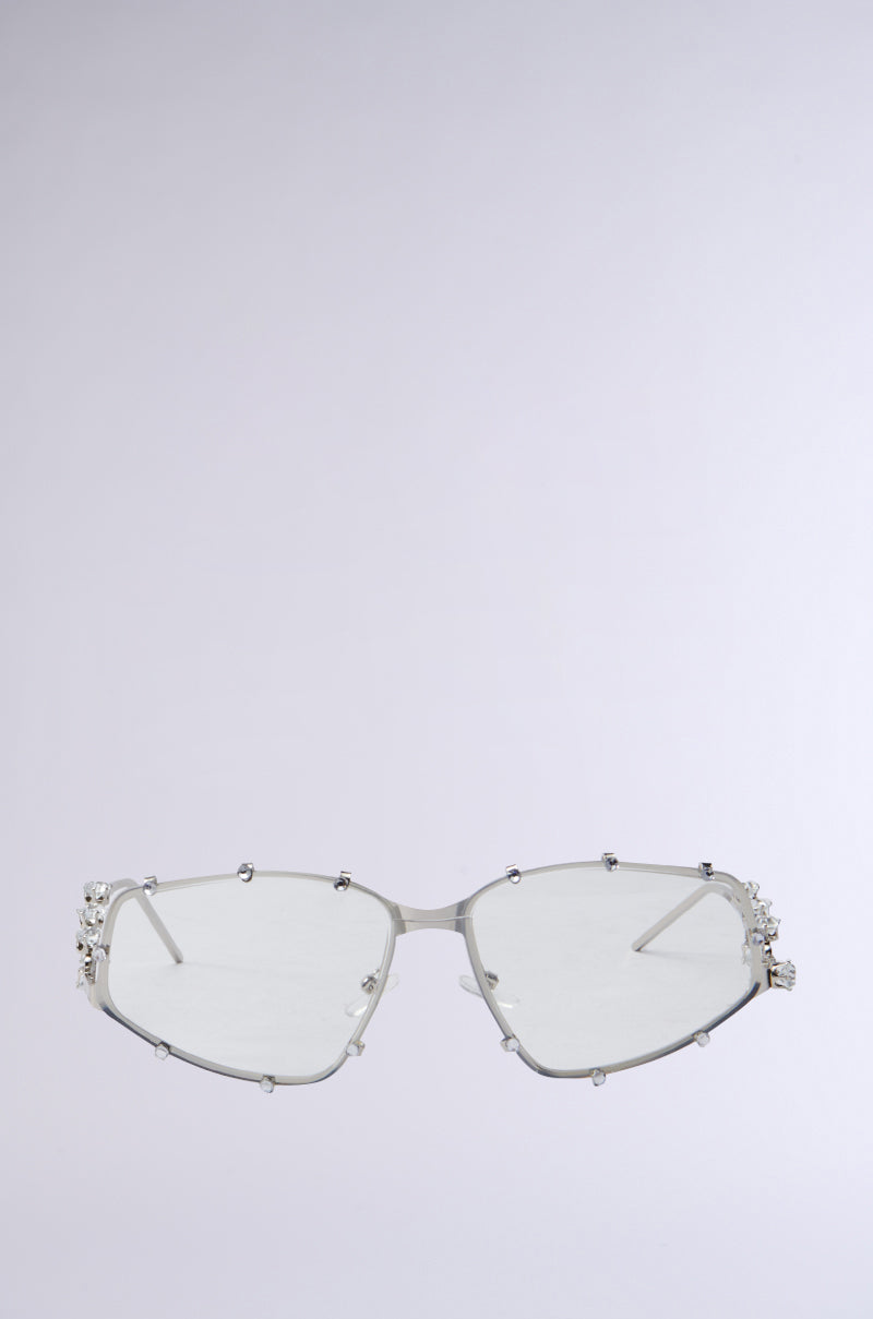 Introducing the PIERCE GLASSES: sleek wire-framed spectacles with silver accents and rectangular lenses, elegantly adorned with sparkling rhinestones along the edges. They truly stand out against a plain white background.