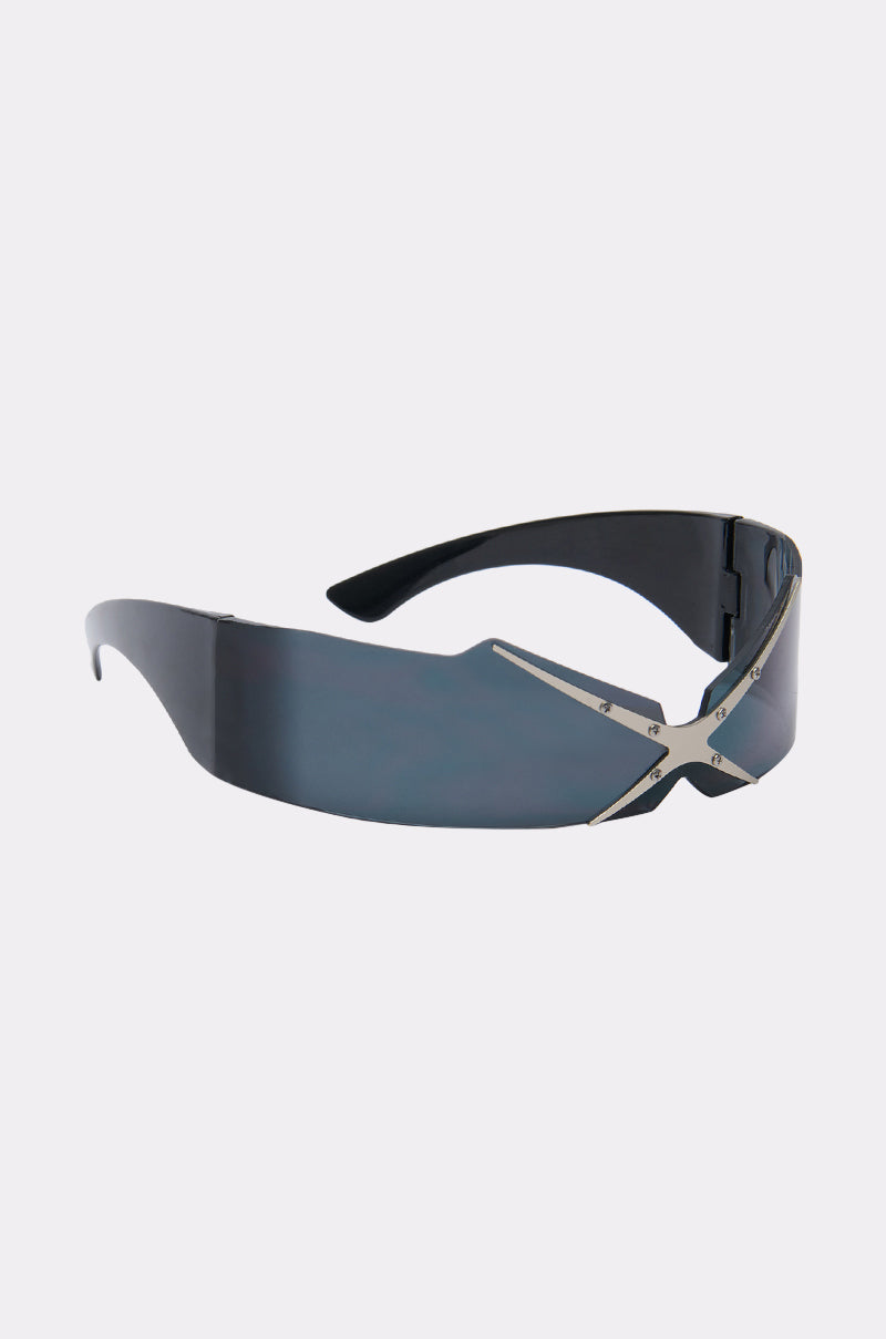 SEE THRU U SUNGLASSES feature a futuristic black shield design, reflective blue lenses, and a bold silver "X" detail on the front, offering standout style with classic wrap-around coverage. 2