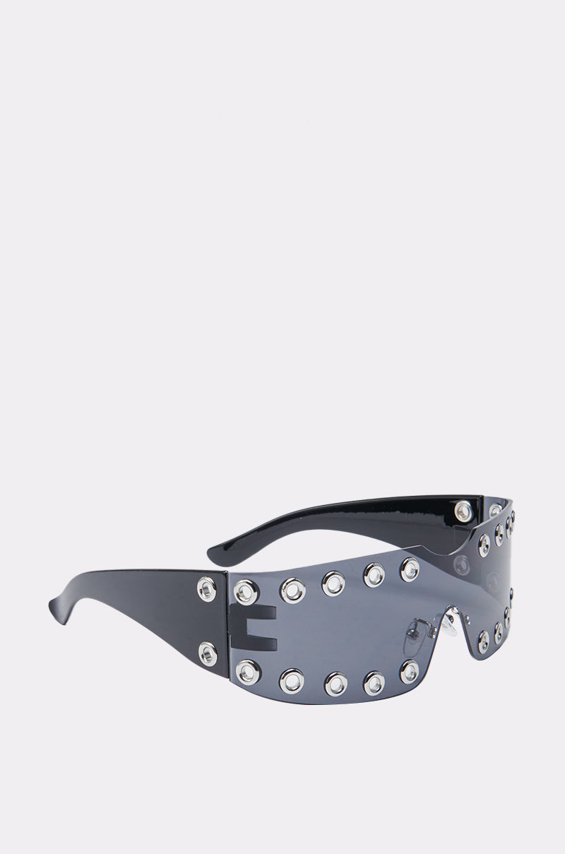 Make a statement with the HERE FOR THE VIBES SUNGLASSES—futuristic wraparound shades featuring a single dark lens, metallic rivets, and bold geometric temple cutouts for standout, trendsetting style. 4