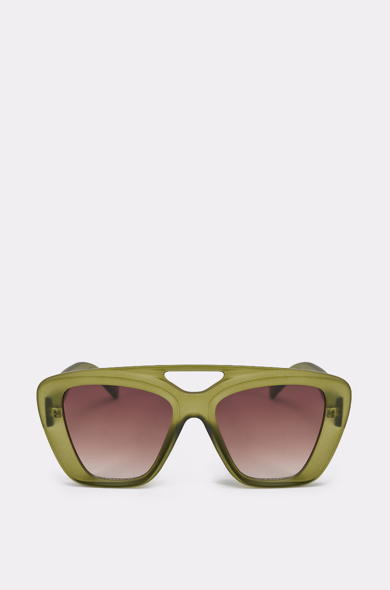 The MAL SUNGLASSES are olive-green, oversized rectangular frames with pink-tinted lenses and a unique cut-out above the nose bridge, displayed against a plain light background. 2