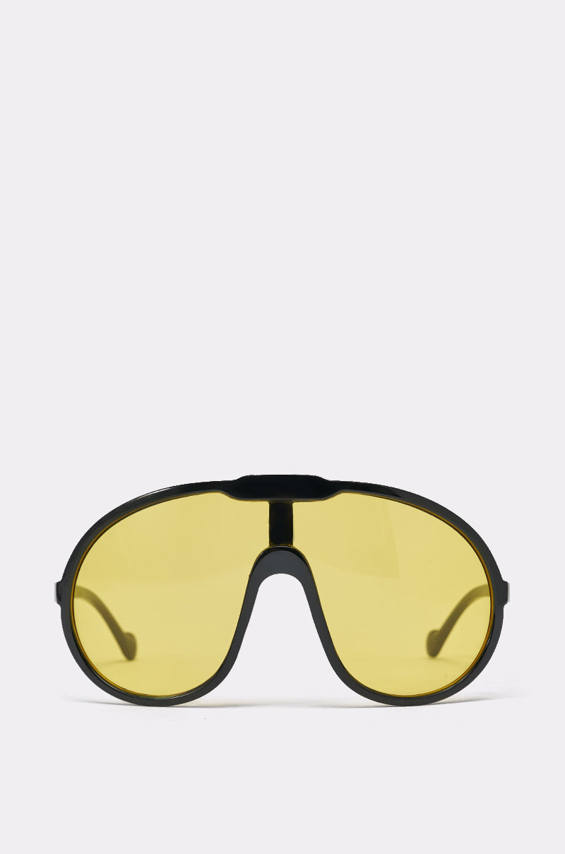 The MOD SUNGLASSES are black-framed, oversized wraparound sunglasses with yellow-tinted lenses, displayed from the front on a plain white background. 2