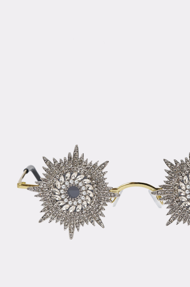 WHY DO I NEED TO SEE SUNGLASSES: Gold-framed, starburst sunglasses featuring circular spiked designs with rhinestones around each lens for a bold, decorative style. 3