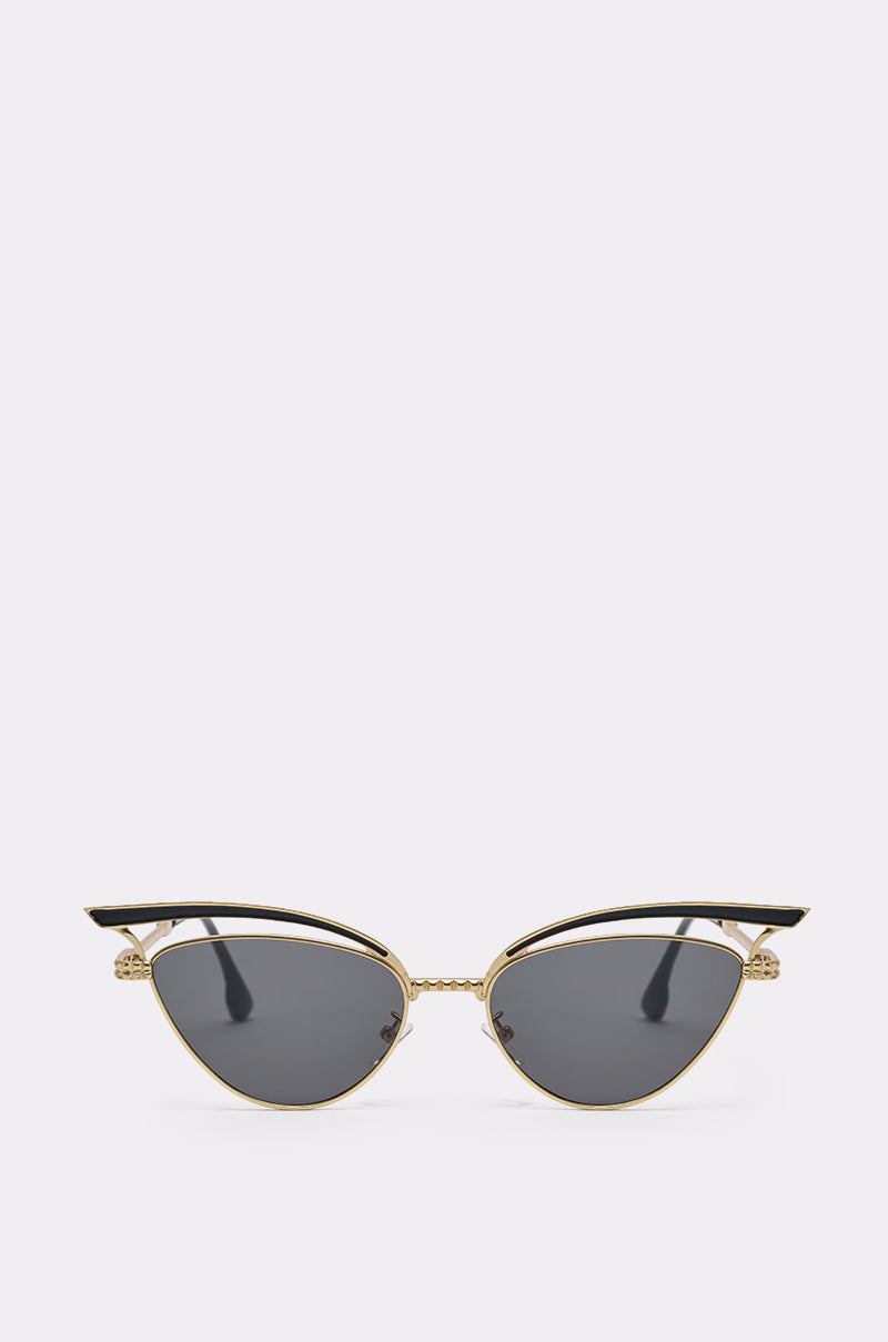 AUDREY SUNGLASSES: Stylish cat-eye frames with gold accents, black upper rims, and dark tinted lenses, shown on a light gray background. 0