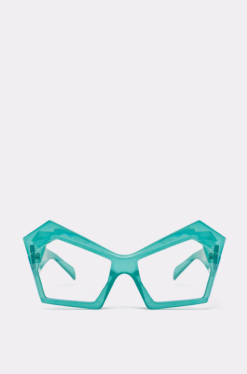 The KYLEIGH GLASSES are bold, geometric teal sunglasses featuring oversized square lenses and angular frames, shown against a plain white background. 1